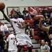 Milan sophomore Latin Davis tries to score on Friday. Milan won 71-40. Daniel Brenner I AnnArbor.com